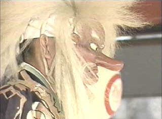 Close-up of masked performer representing Ninigi at a sato-kagura performance